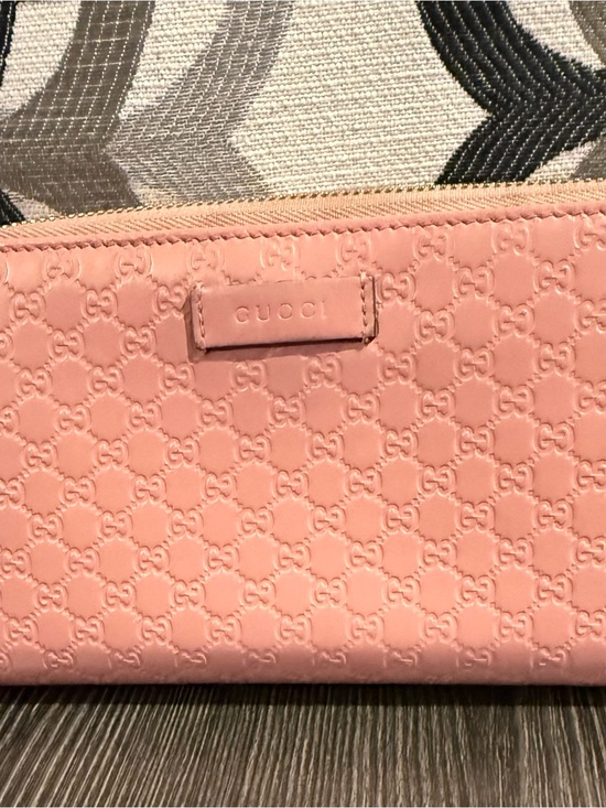 Gucci Handbags - Gucci Pink Embossed microguccisima zippy wallet.